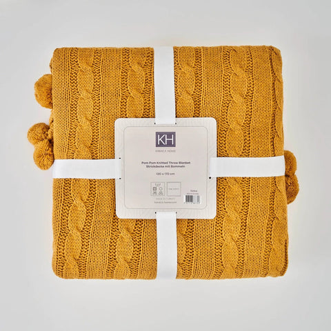 Karaca Home gestrickte Bommel Decke dunkelgelb
